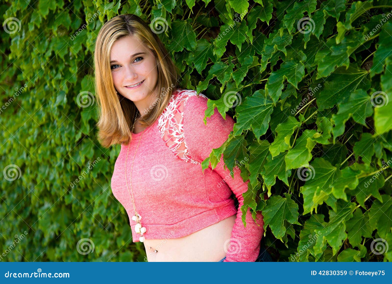 Pretty Teen Girl Pink Sweater Green Ivy Stock Image