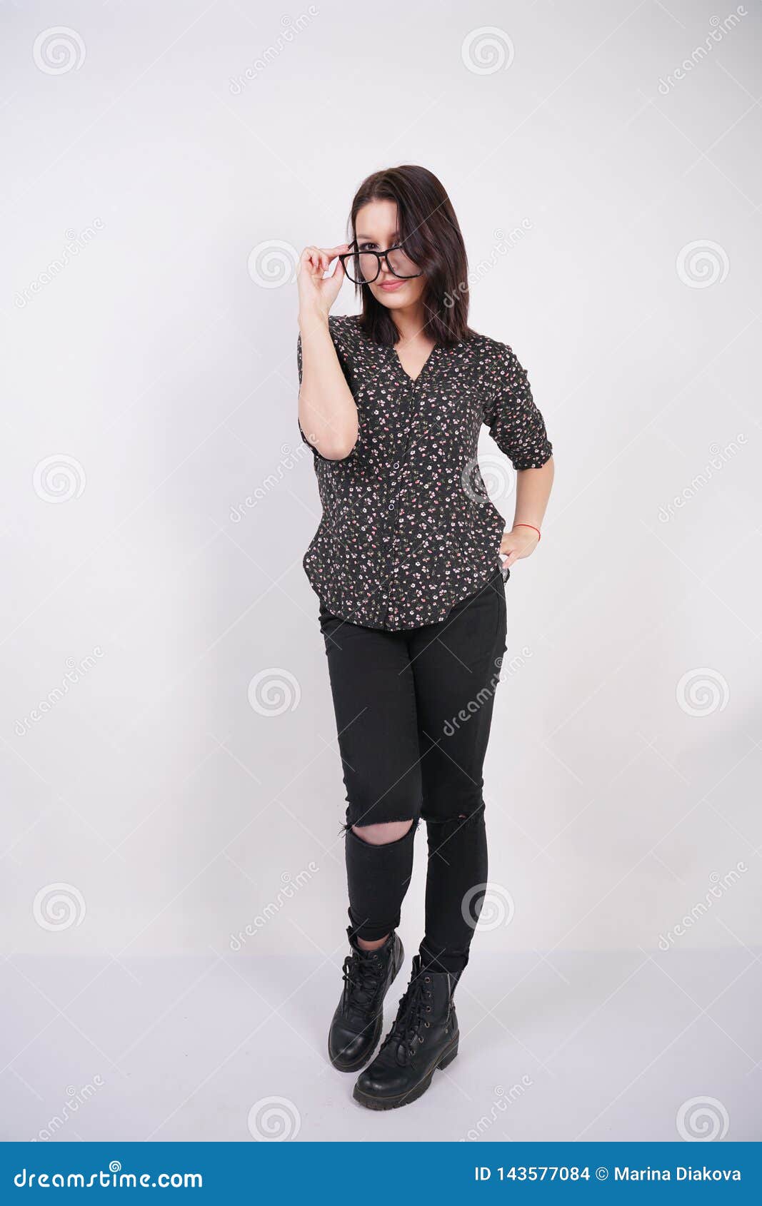 Pretty Teen Girl Wearing Fashion Casual Shirt And Black Torn Jeans 