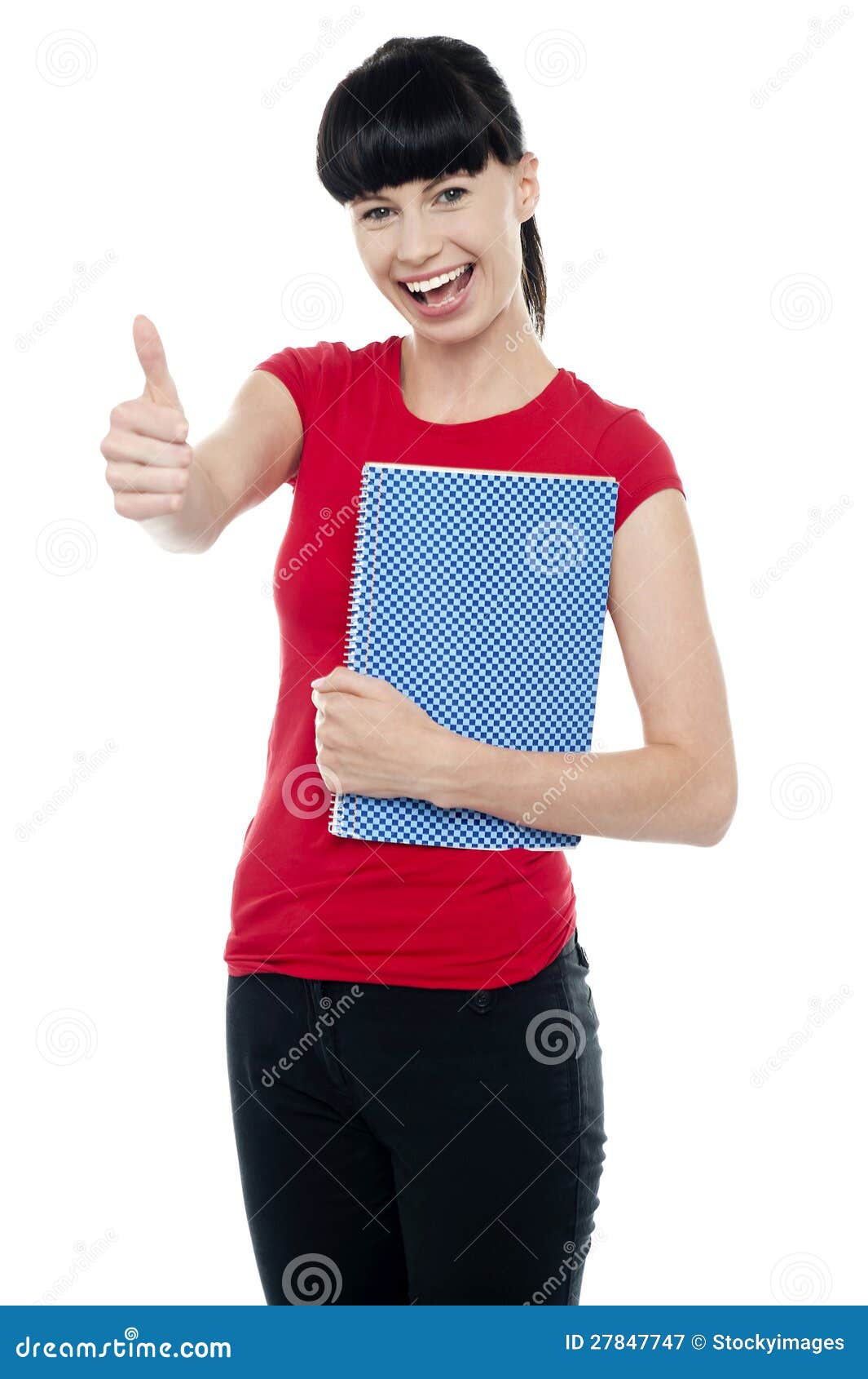 Pretty teenager holding notebook and gesturing thumbs up. All against white background.