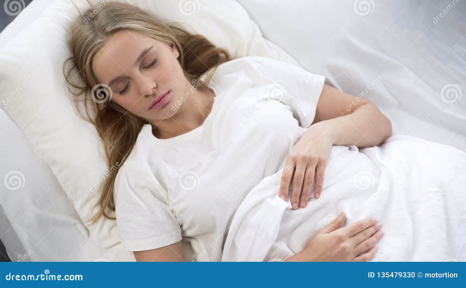 Pretty Teenager Peacefully Sleeping In Bed Relaxing In Morning Dream