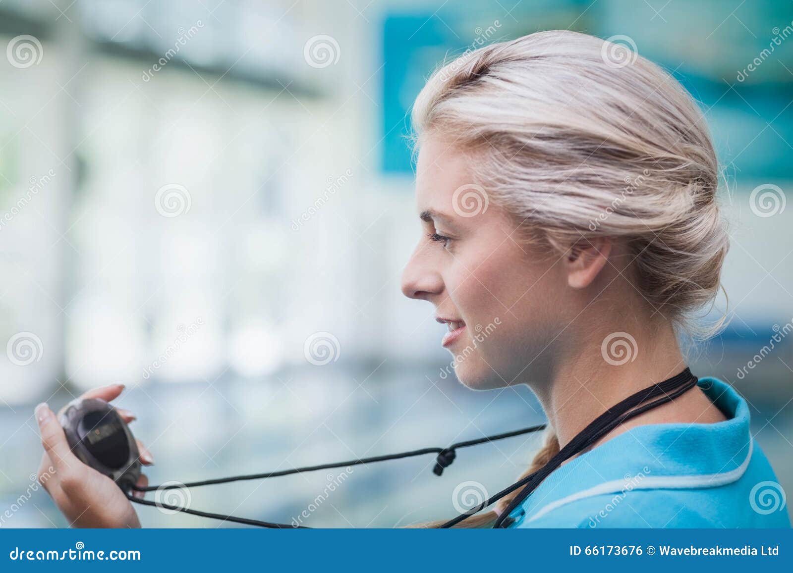 Pretty Trainer Looking at Stopwatch Stock Photo Image of stopwatch