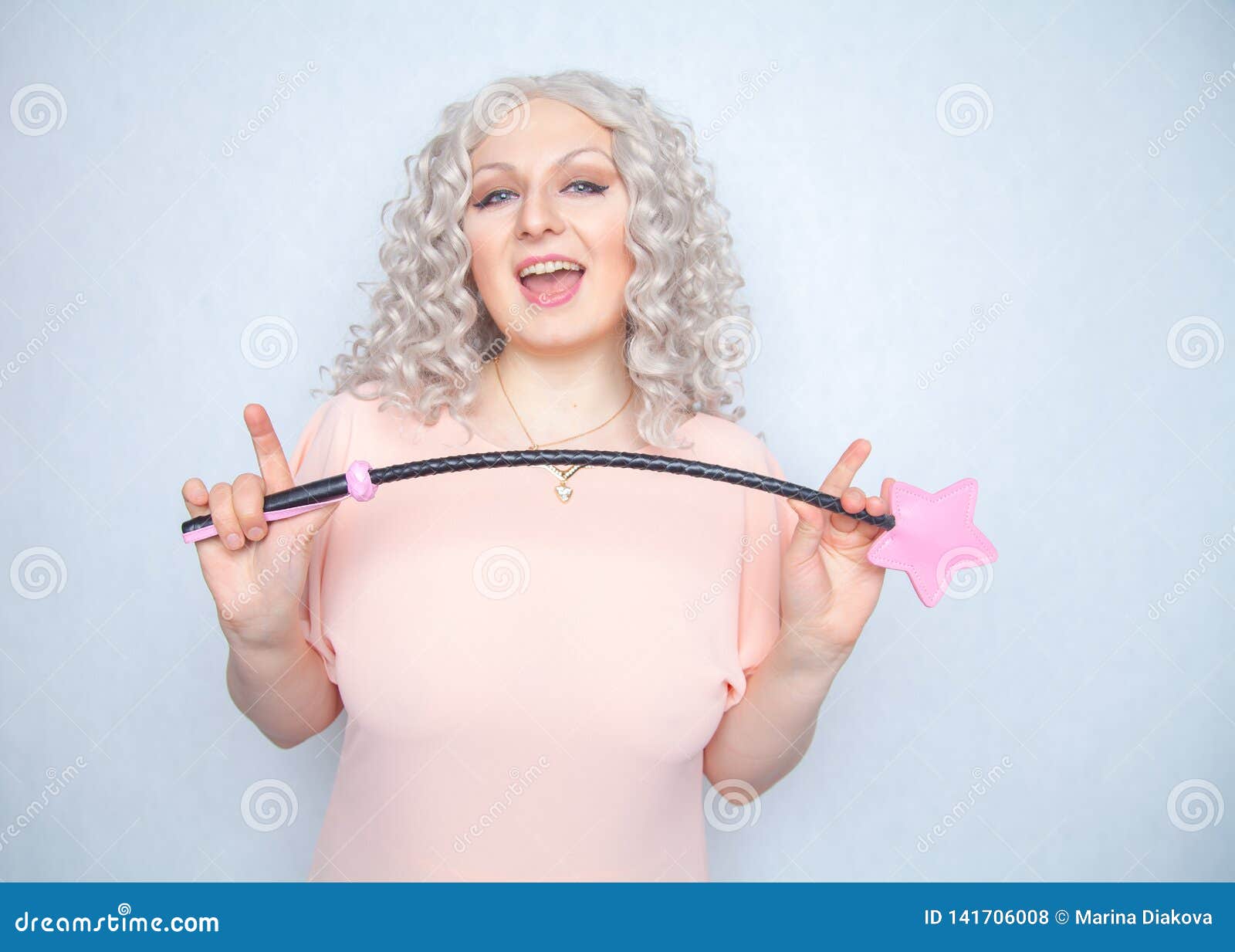 Kinky Pretty Woman with Pink Star Riding Crop pic