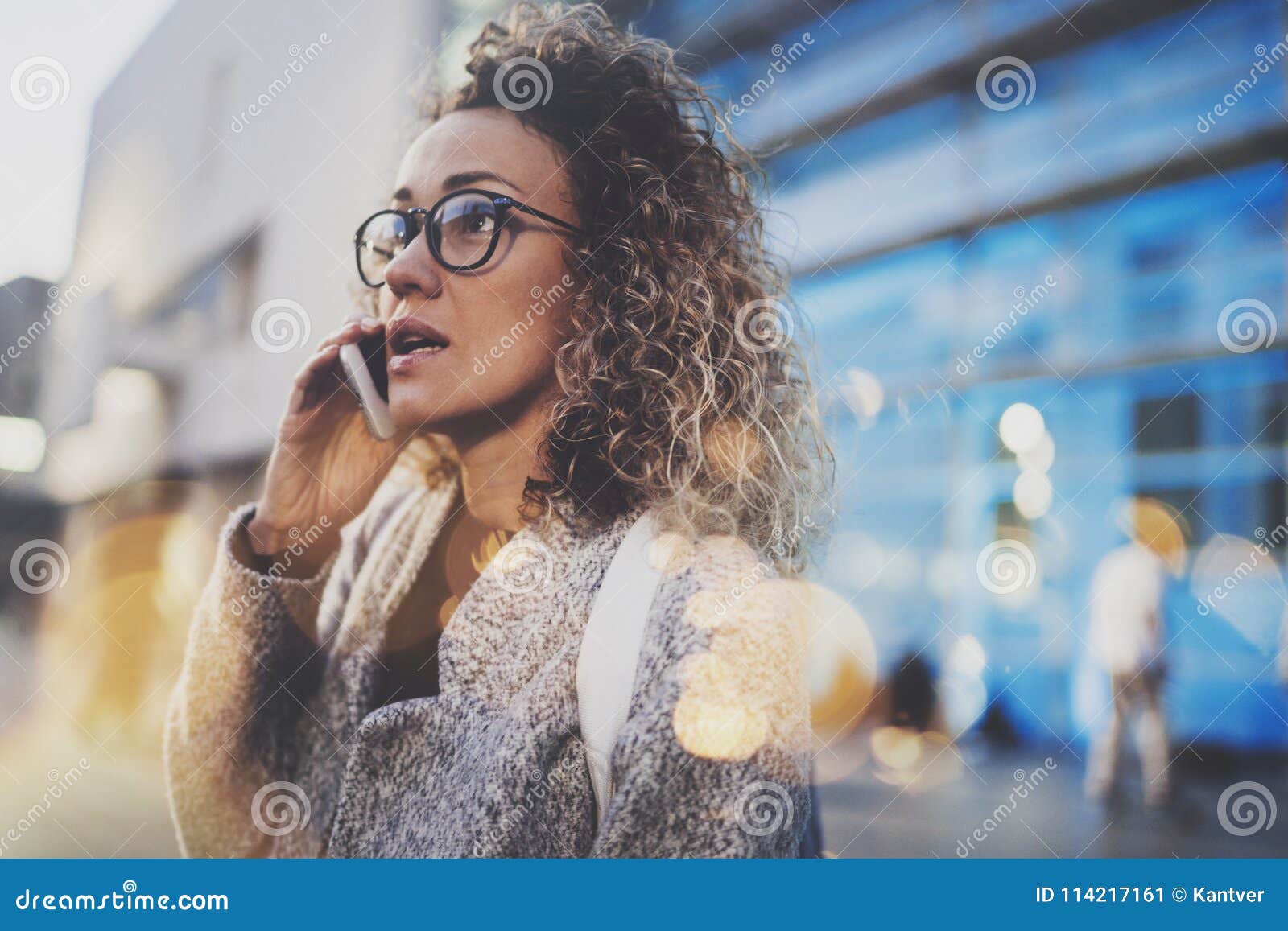Pretty Woman Calling with Her Cell Telephone while Standing at Night on ...