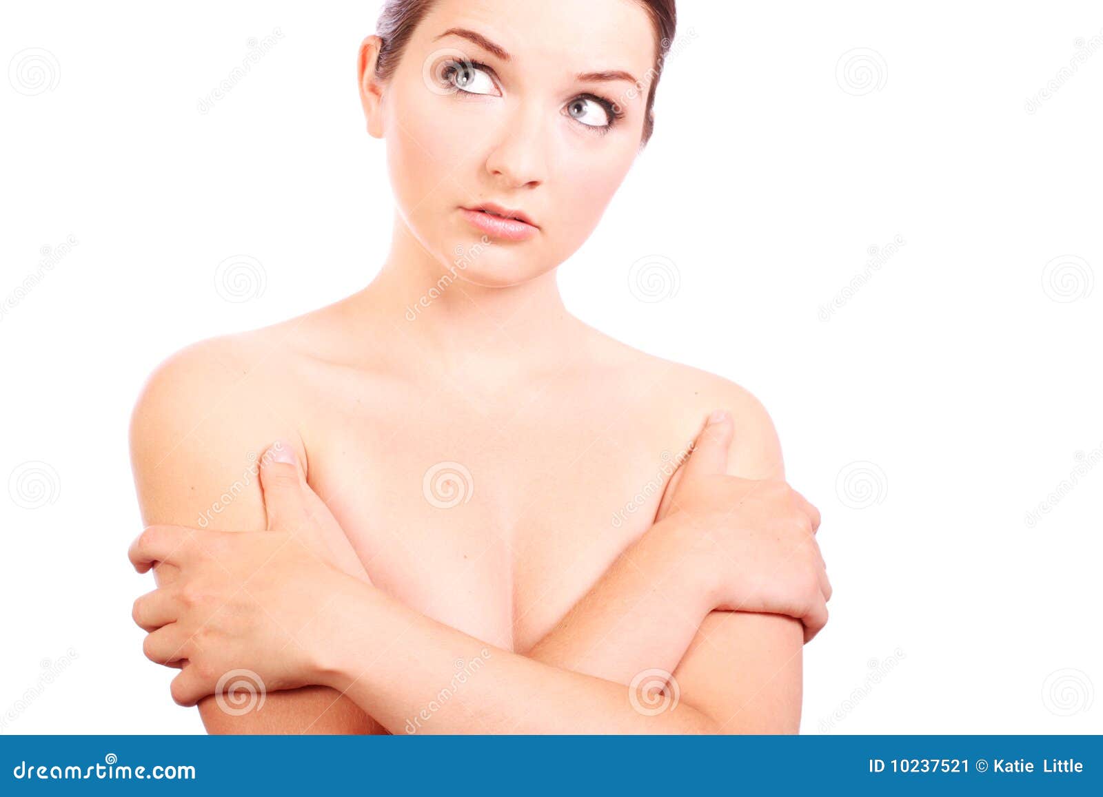 Foto de Middle part of girl with beautiful breasts and lips. Woman cover  her breasts by hands. do Stock