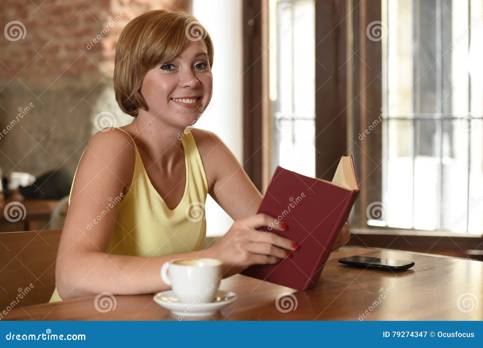Pretty Woman Enjoying Reading Book at Coffee Shop Drinking Cup of ...