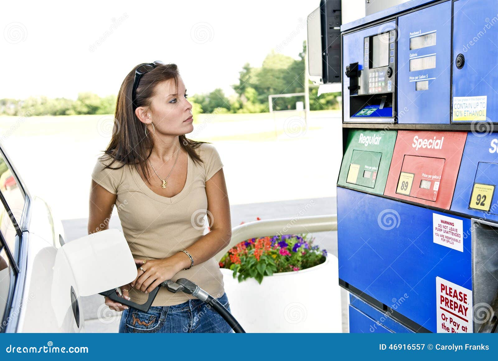 pretty woman pumping gas