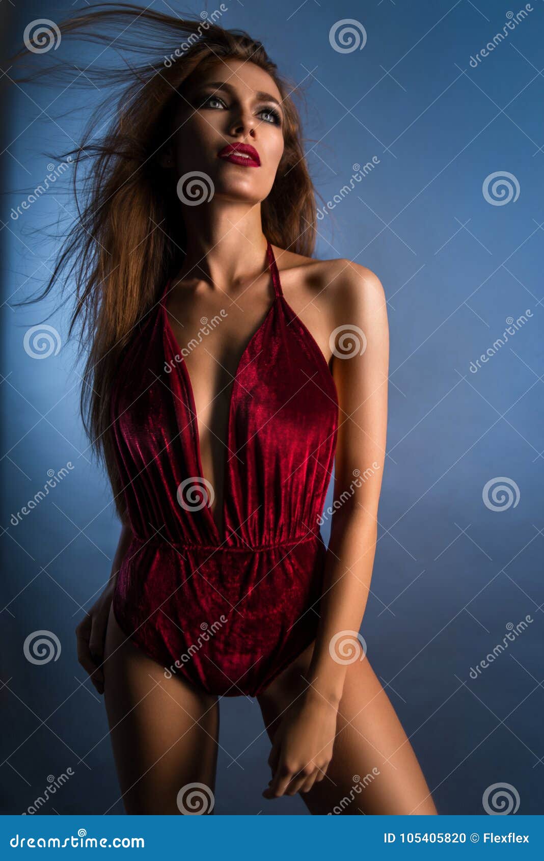 Pretty Woman In Red Bodysuit Posing At Camera Stock Photo Image Of
