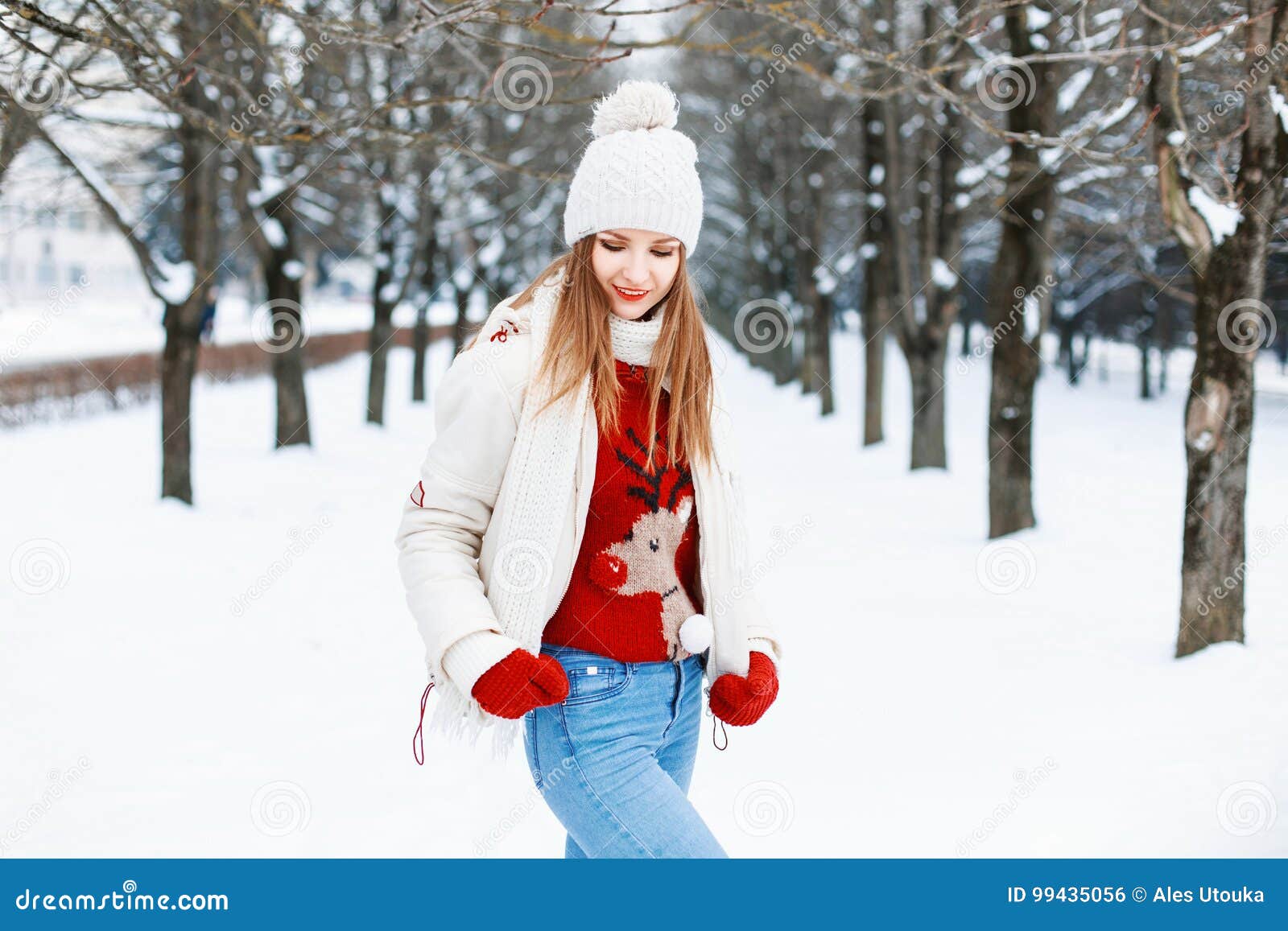 Pretty Woman in a Red Sweater, a White Cap and a Jacket, Knitted Stock ...