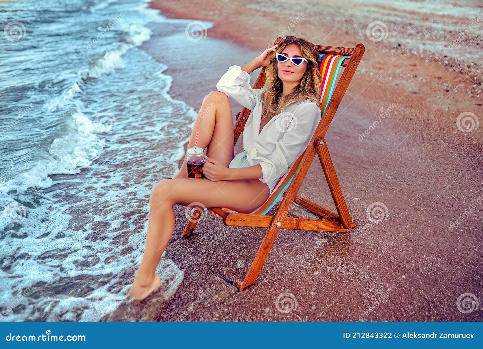 Pretty Woman Relaxing On A Lounger Beach And Drinks Soda Water Stock Photo Image Of Girl