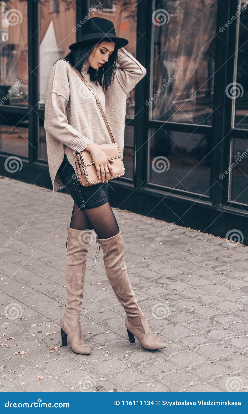 Pretty Woman with Short Dark Hair in Elegant Outfit and Black Ha Stock ...