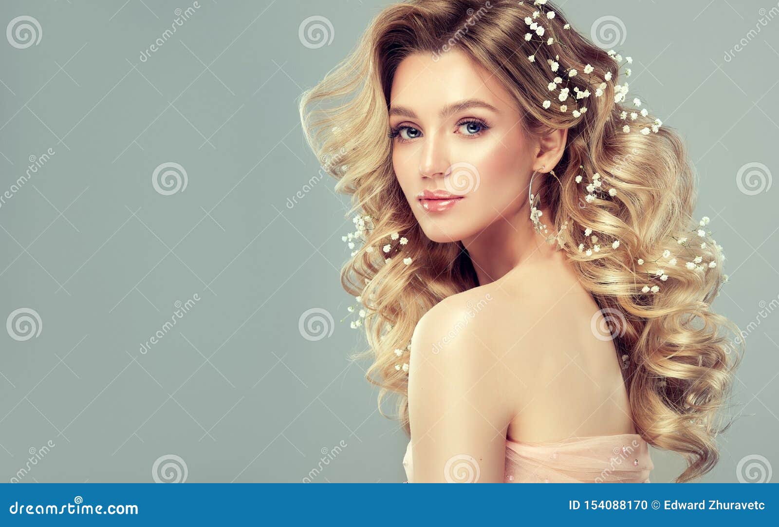 Pretty Woman with Soft Smile on the Face is Demonstrating Long and Curly  Hairstyle. Stock Photo - Image of girl, elegance: 154088170