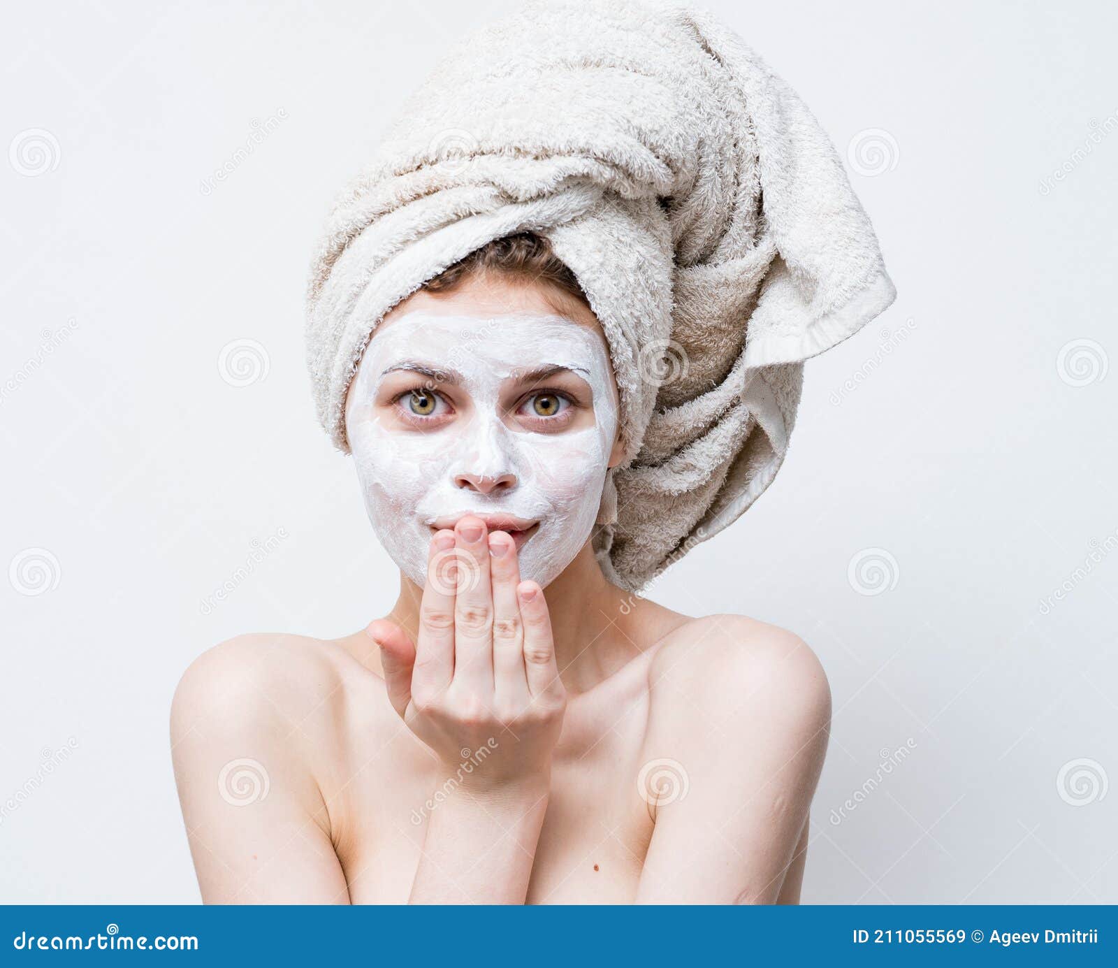 Pretty Woman With A Towel On Her Head And A White Mask Against Black Dots On Her Face Stock