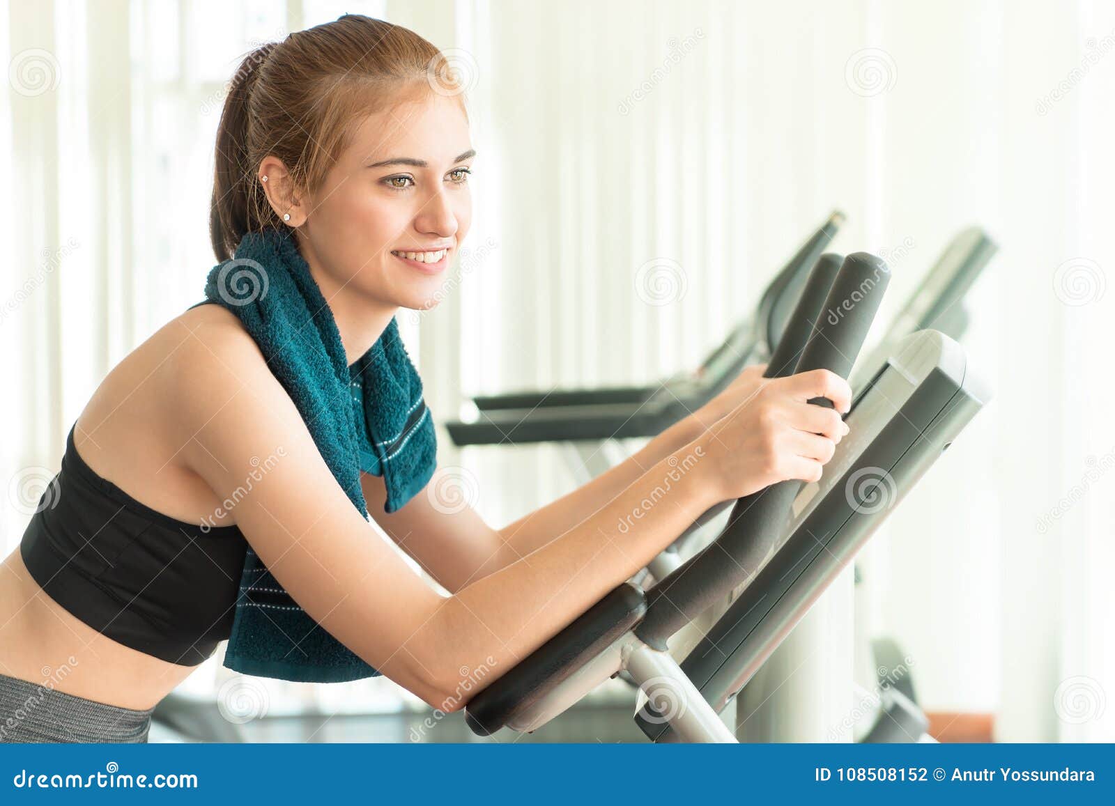 Pretty Woman Working Out on Exercise Bike Stock Photo - Image of ...