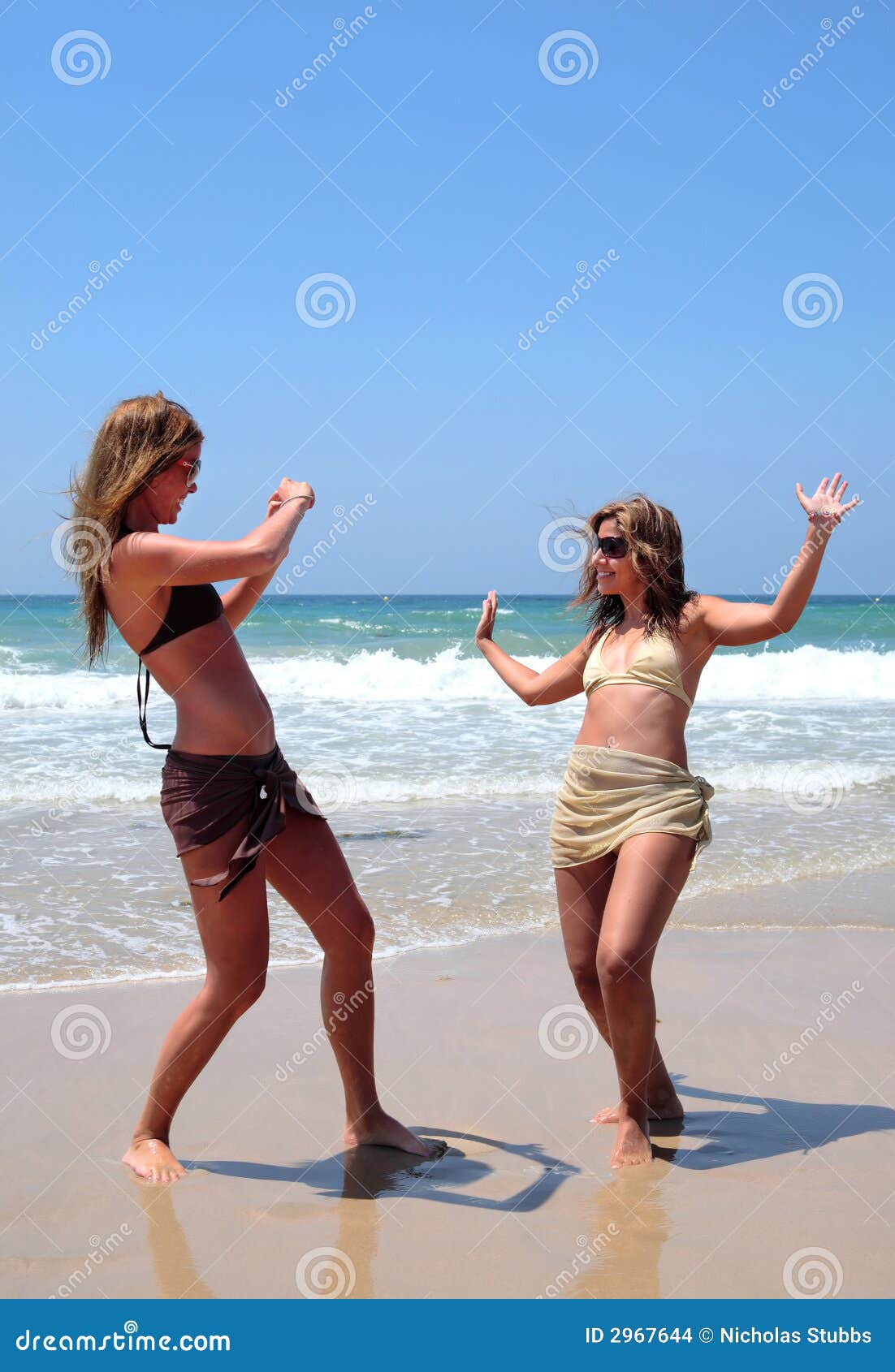 Pretty Women Playing on Beach Stock Photo image