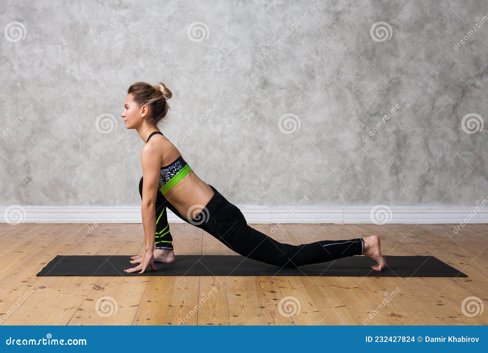 Young Woman Practicing Ashwa Sanchalanasana The Equestrian Yoga Pose  Against Texturized Wall Urban Background Stock Photo - Download Image Now -  iStock