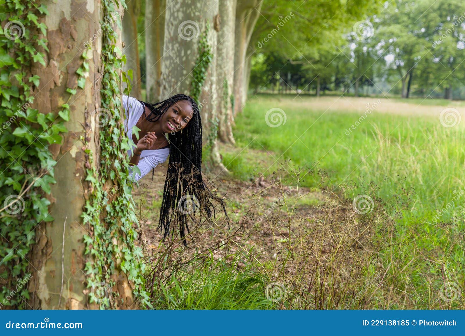 Happy Woman Hiding Behind Tree Stock Image Image Of Field Fitness 229138185 