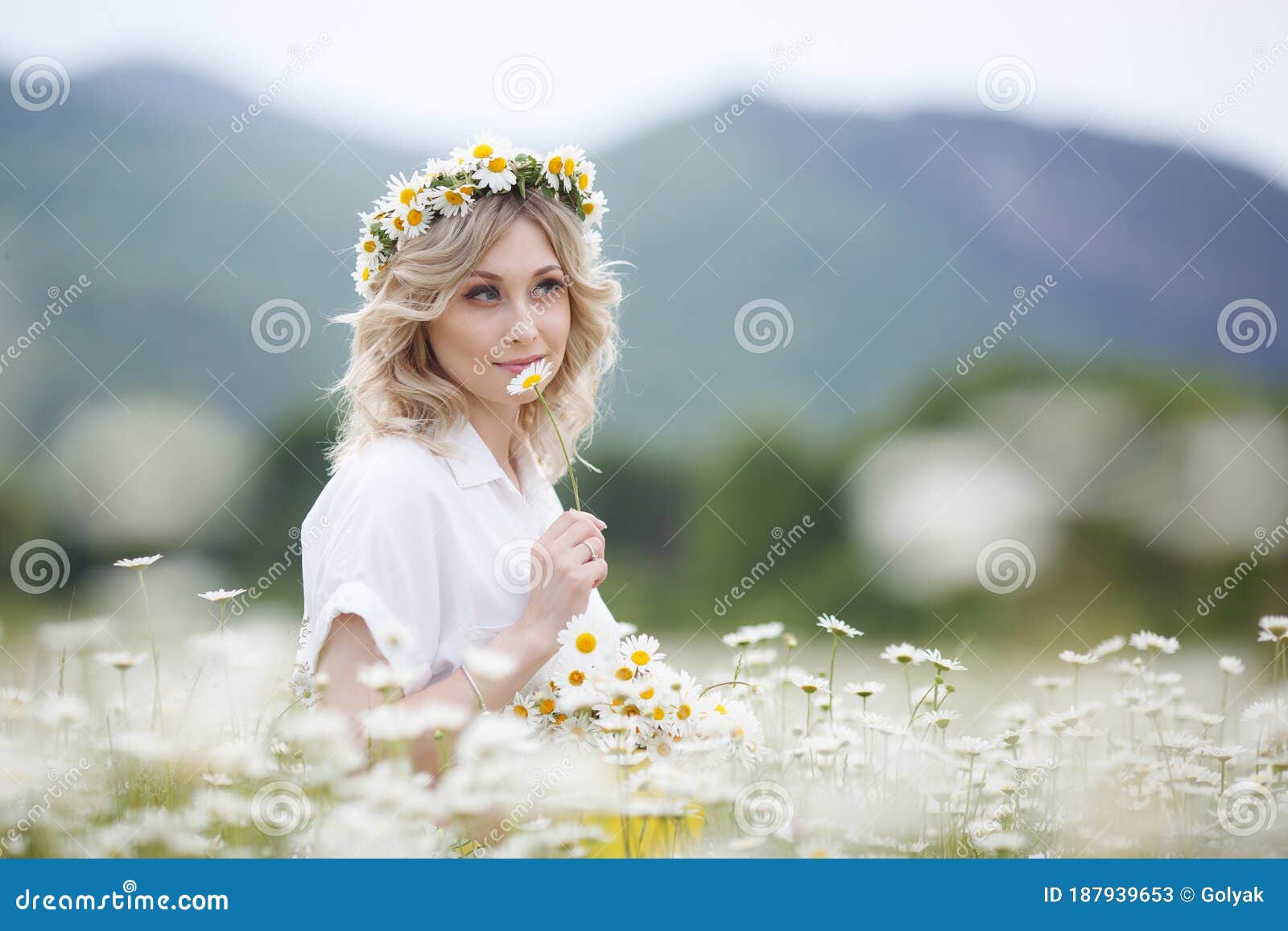 Pretty Young Blonde Woman with Camomiles in White Blooming Field. Girl ...