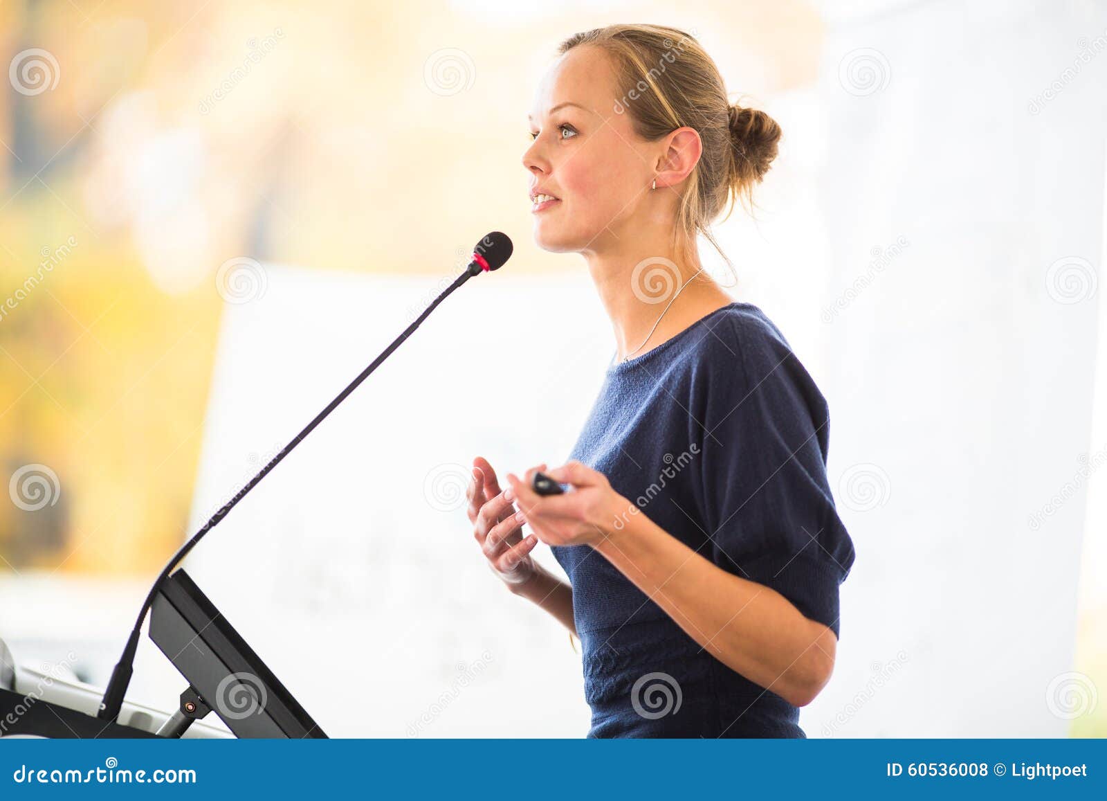 pretty, young business woman giving a presentation