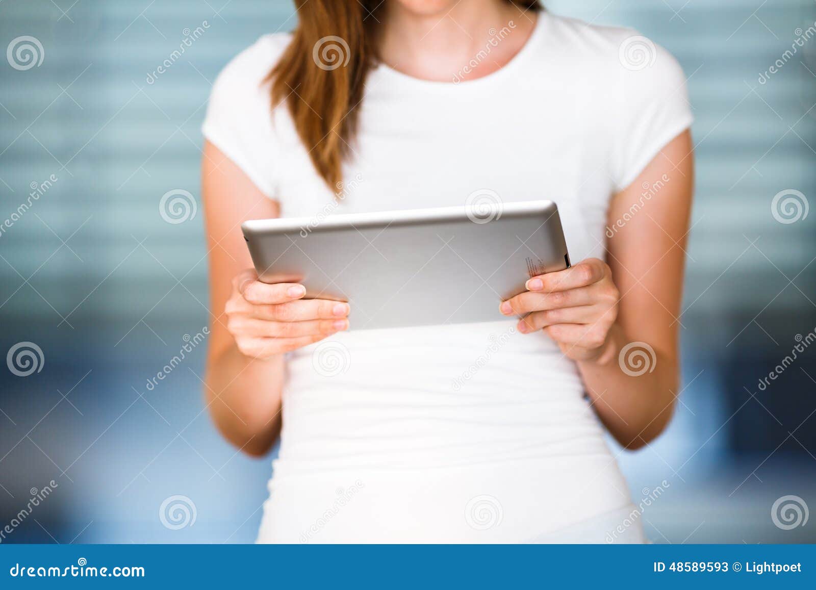 pretty, young businesswoman/colle ge student using her tablet