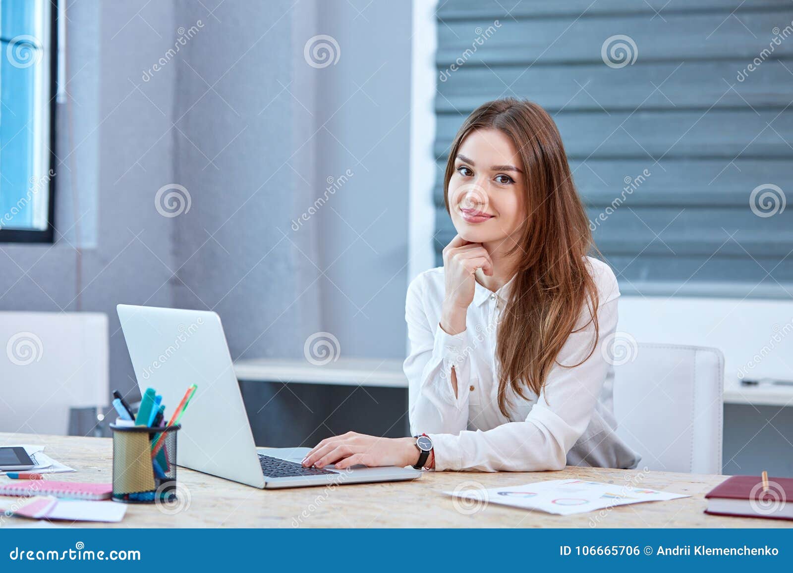 A Girl Office Worker, Sitting at Table with Laptop and Smiling. Stock Photo  - Image of corporate, businessman: 106665706