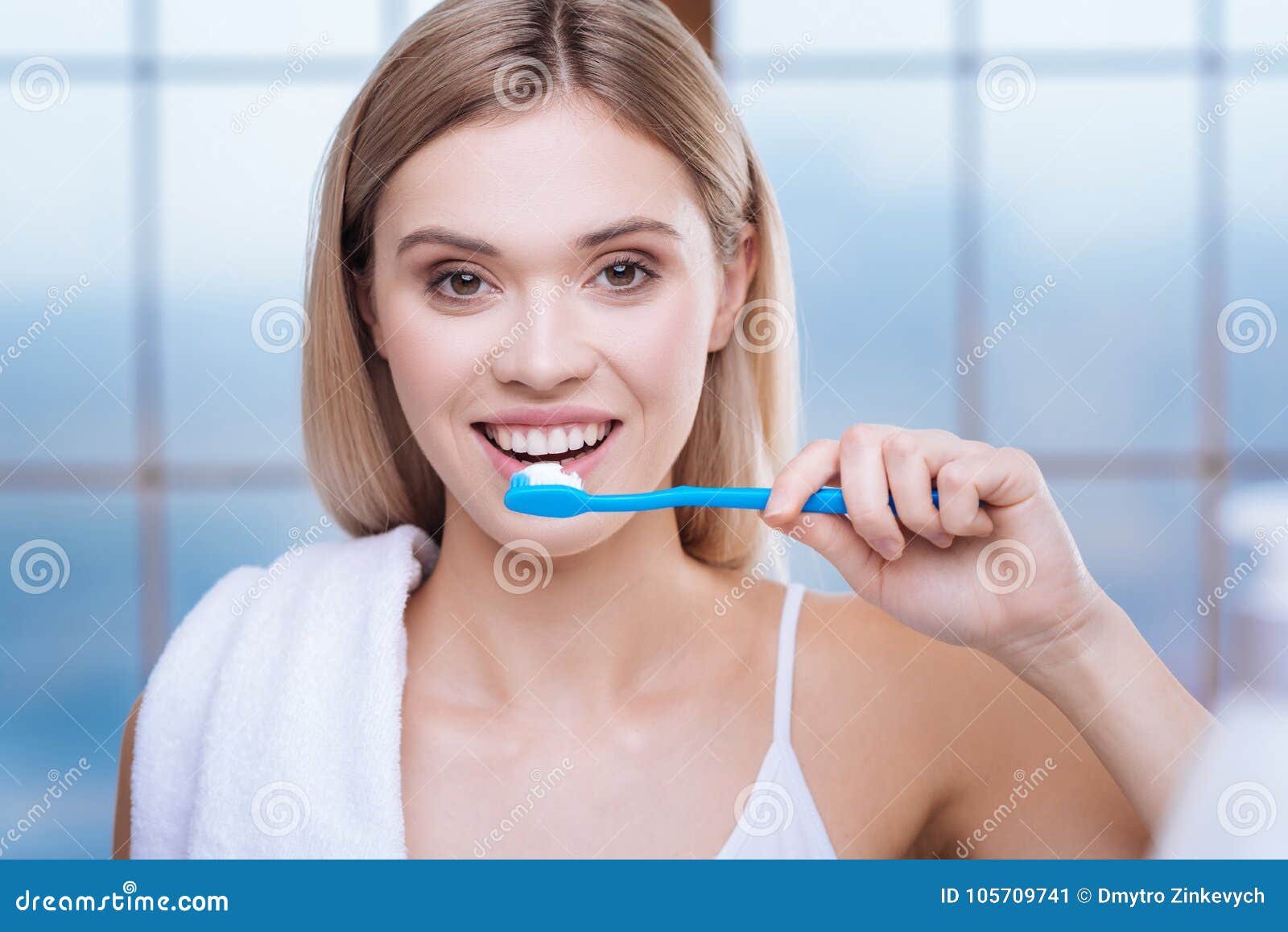 wife brushes her teeth