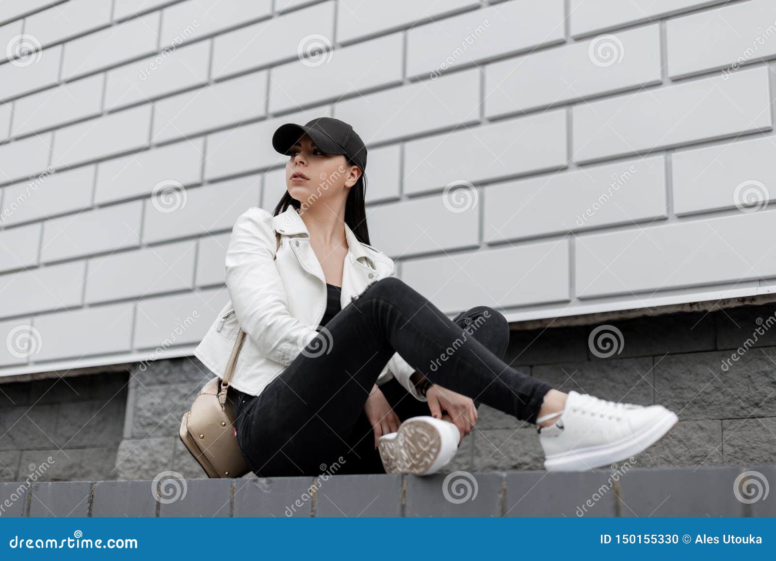 Premium Photo | Elegant beautiful young woman model in fashion casual  clothes with a white shirt and black jeans stands near a vintage building  in the city pretty girl