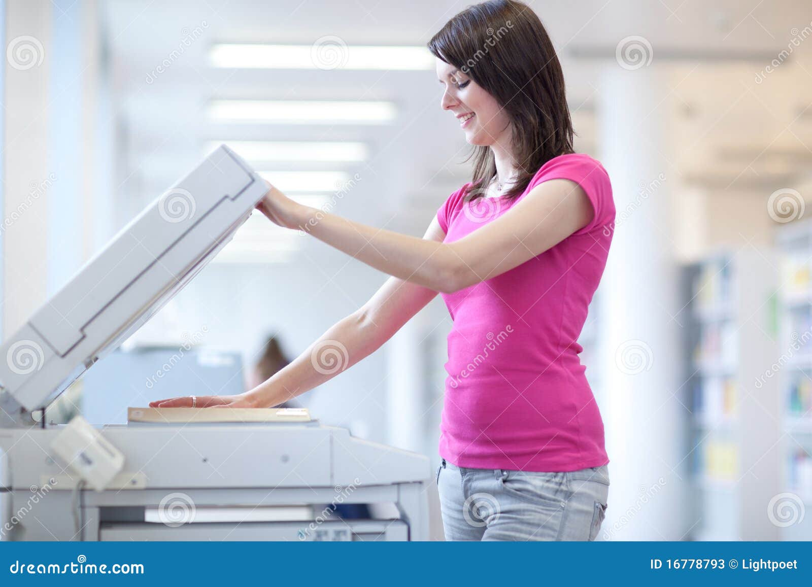 pretty young woman using a copy machine