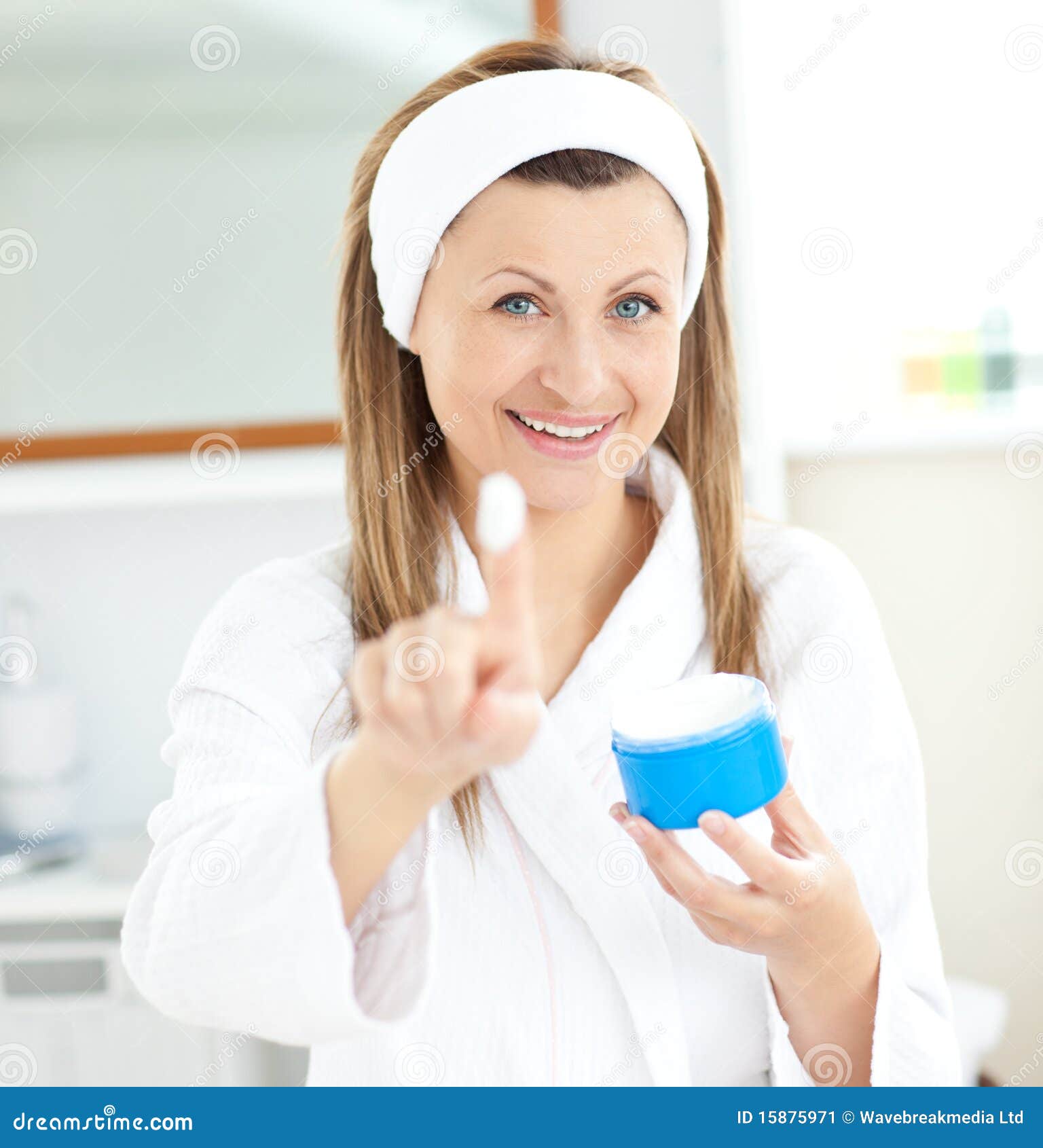 Pretty Young Woman Using Cream Wearing a Bath Robe Stock Image Image