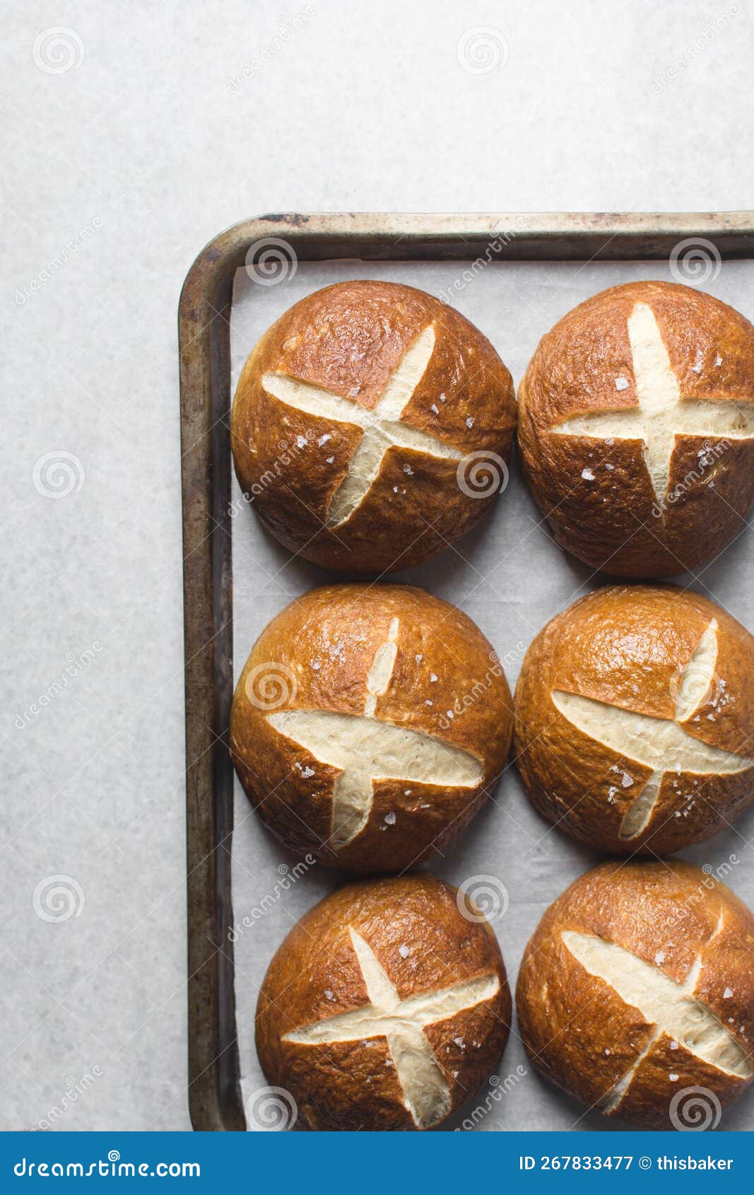 Pretzel Buns on a Parchment Lined Baking Sheet Stock Image Image of