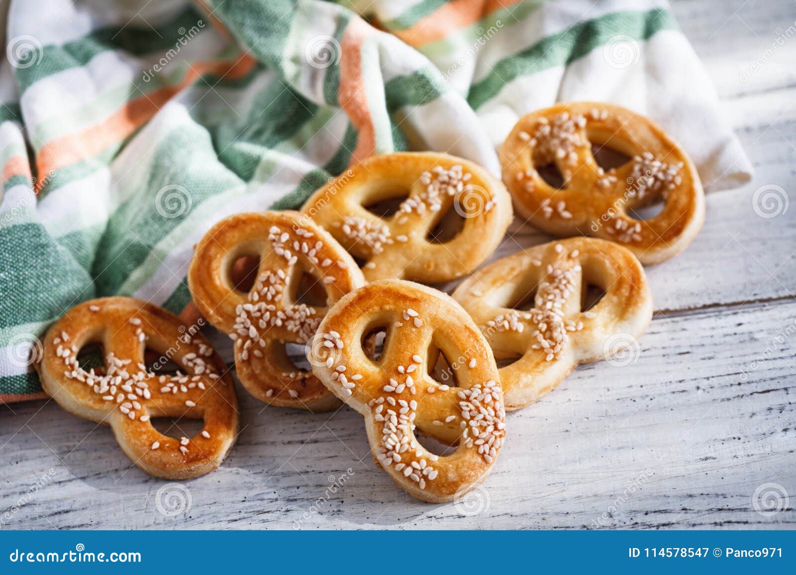 Pretzel with sesame seeds stock image. Image of wood 114578547