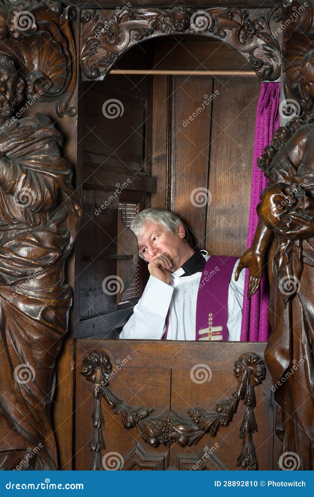 priest in confession booth