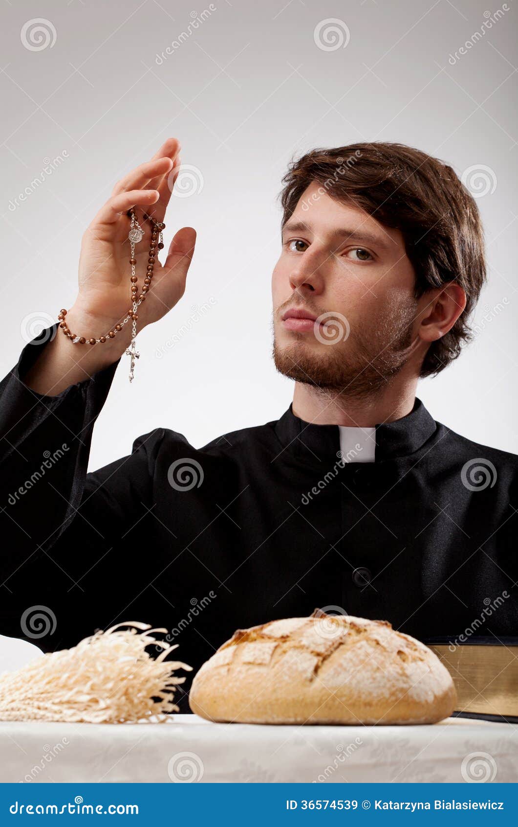 Priest With Rosary, Bread And The Bible Stock Image Image 36574539