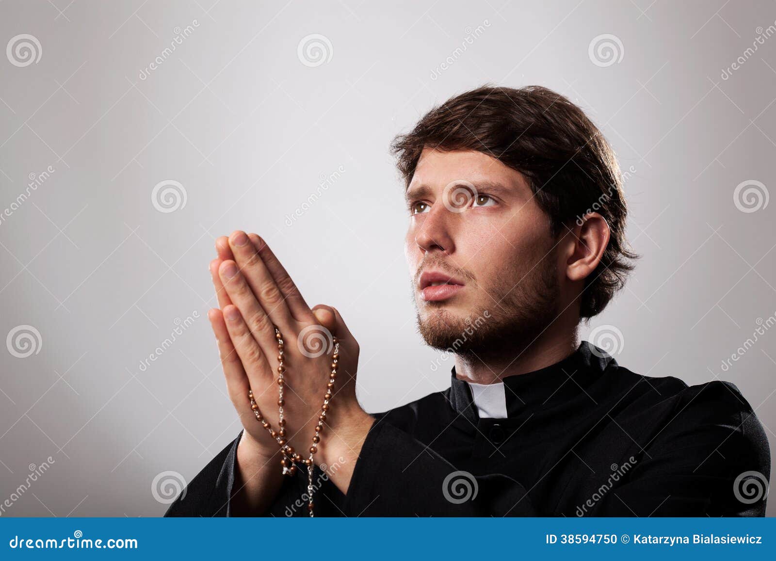 Priest with rosary stock photo. Image of cassock, ecclesiastic - 38594750