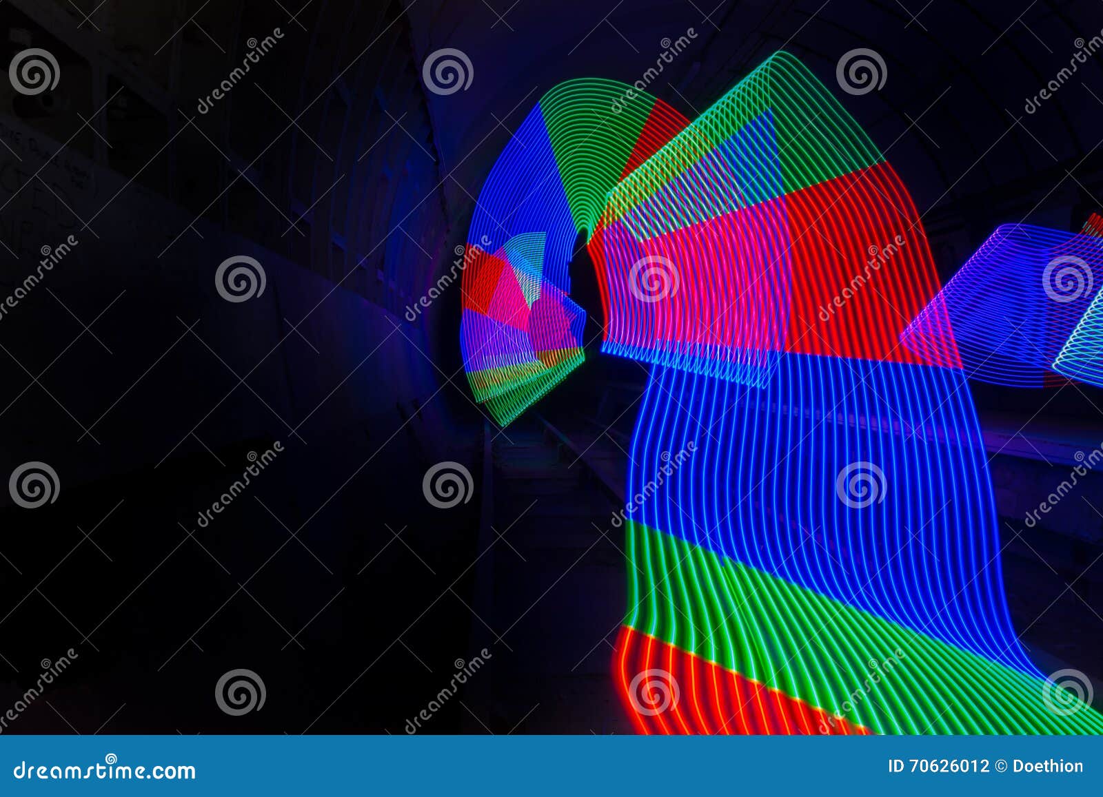 primary colored led lights lighting up a dark tunnel
