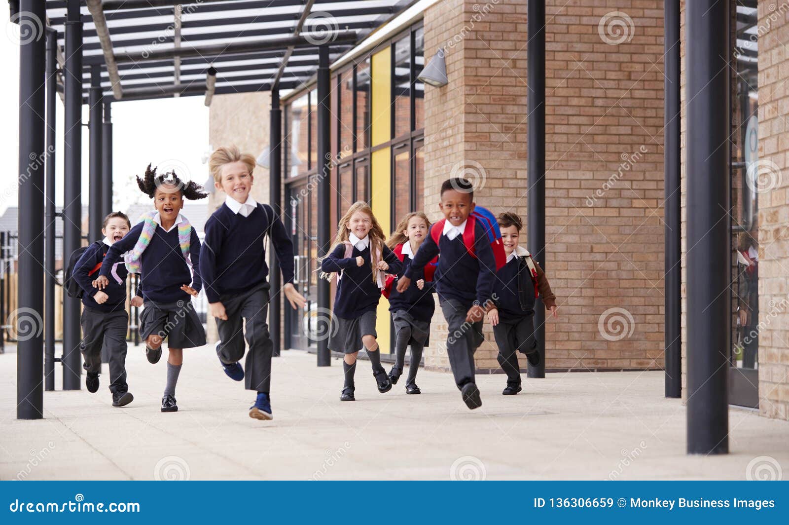 Primary School Kids, Wearing School Uniforms and Backpacks, Running on ...