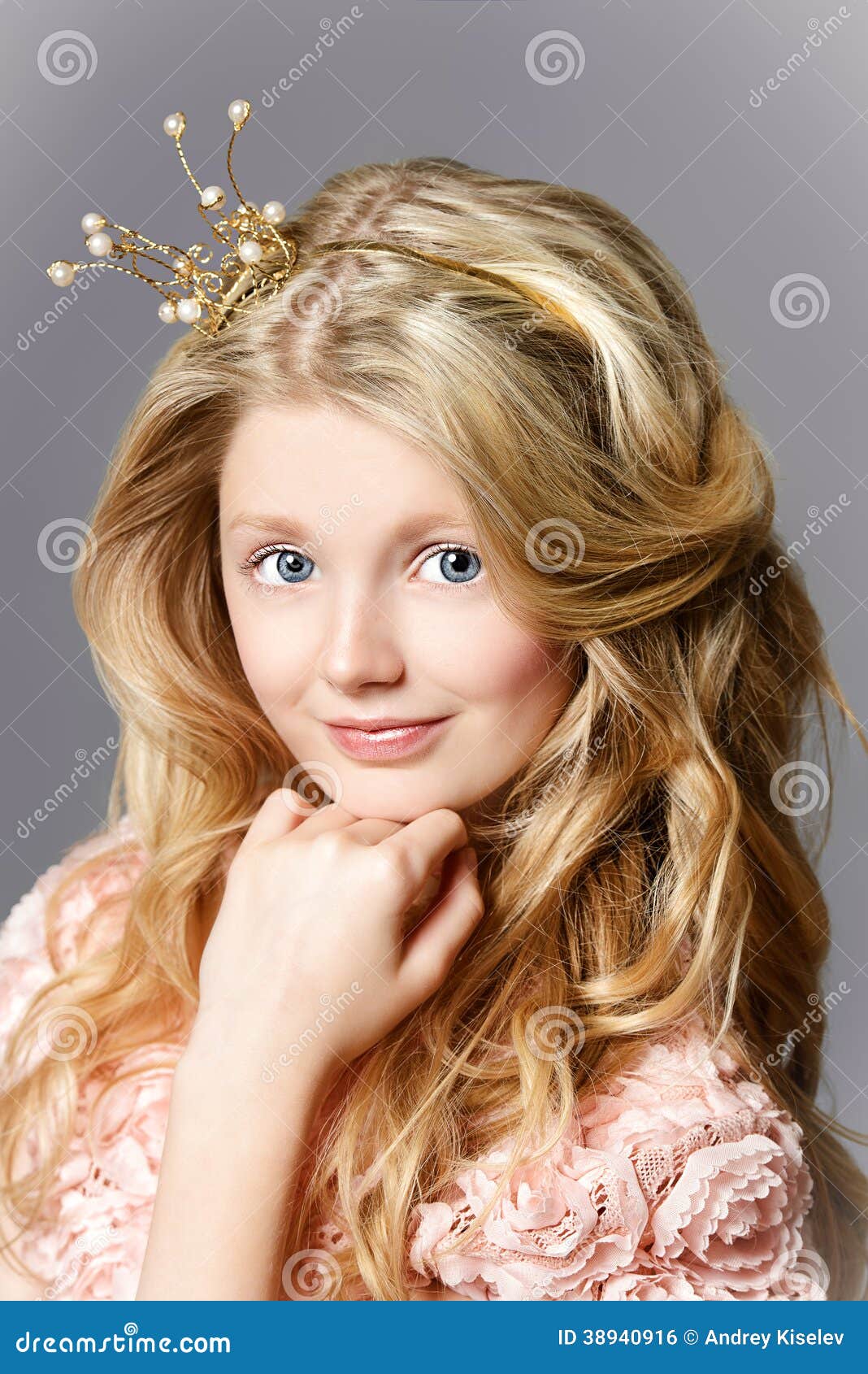 Little Cheerful Beautiful Little Girl Wearing Crown And Sitting At