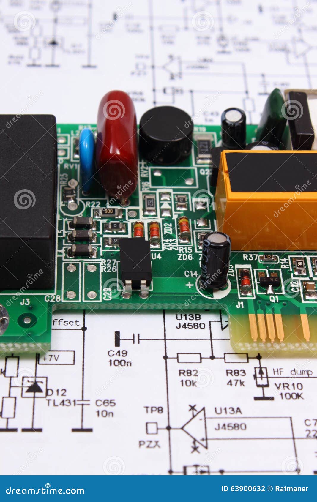 Printed Circuit Board Lying On Diagram Of Electronics