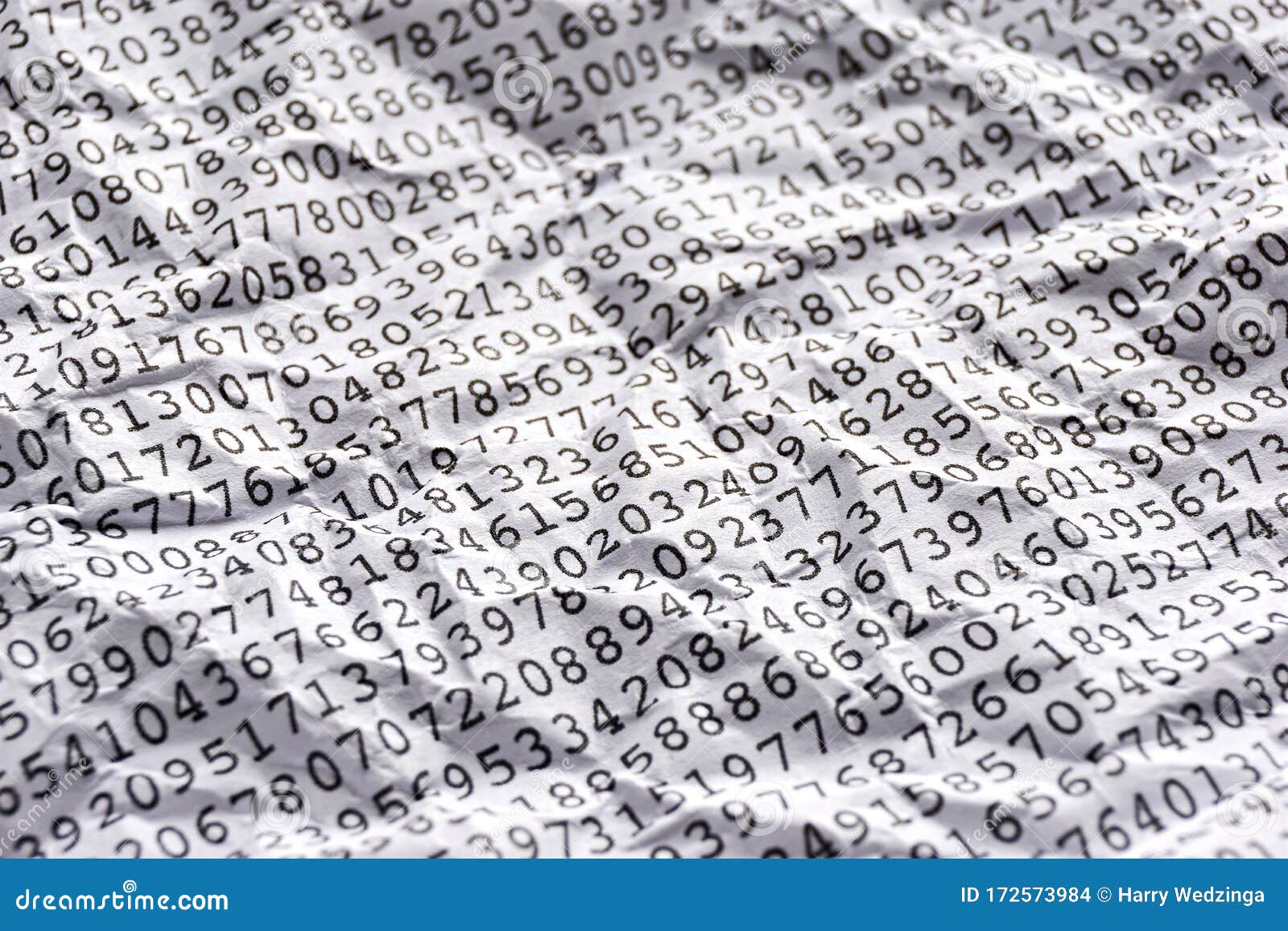 printed random numbers on crumpled white paper
