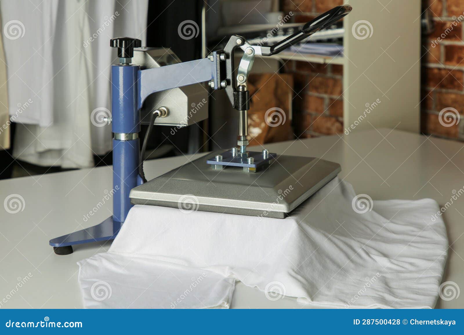 Printing Logo. Heat Press with Tshirt on White Table, Space for Text