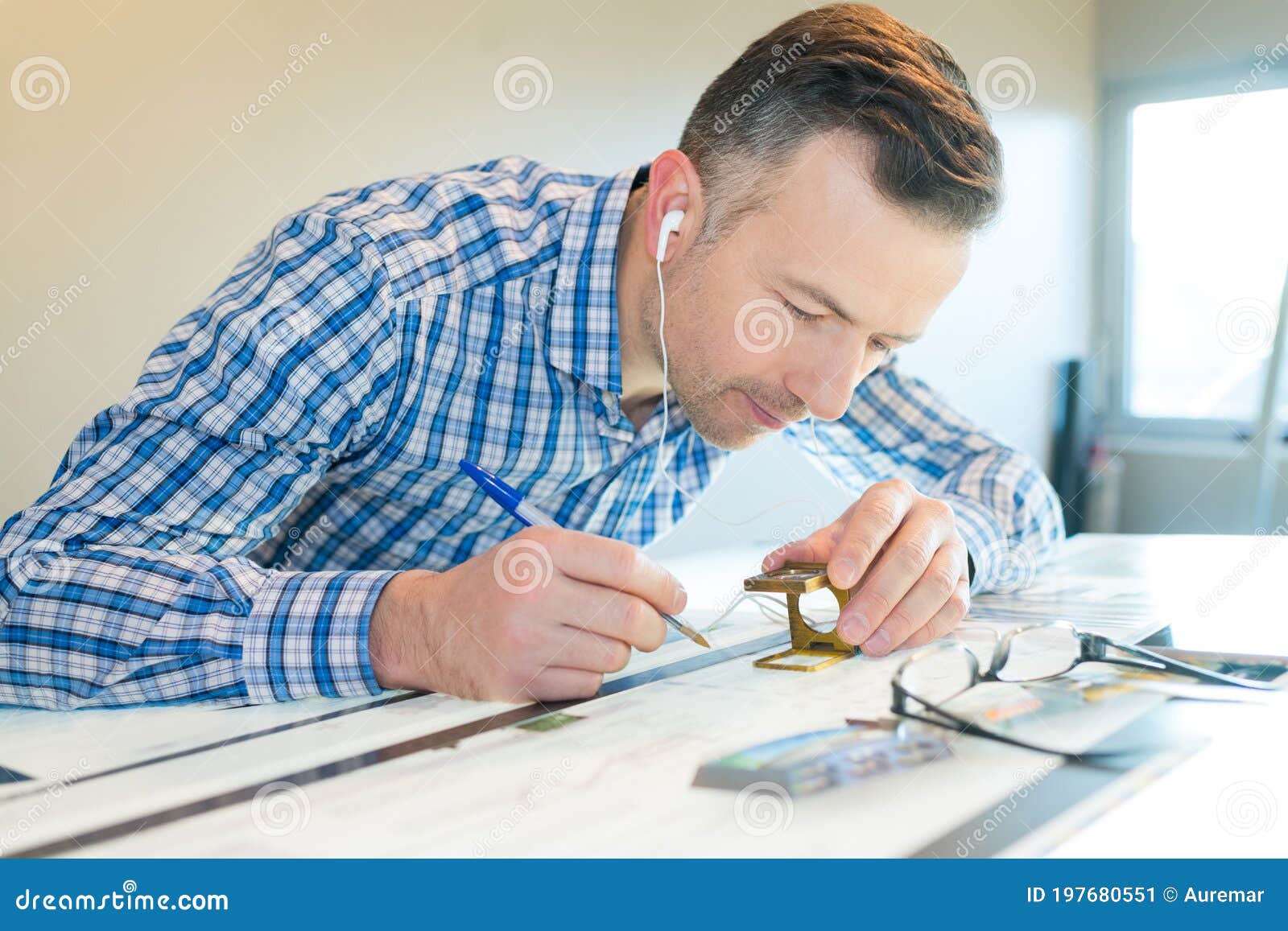 Printing Press Worker Using Precise Magnifying Glass Stock Image