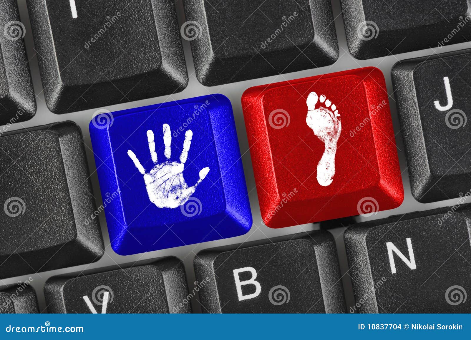 printout of hand and foot on computer keys