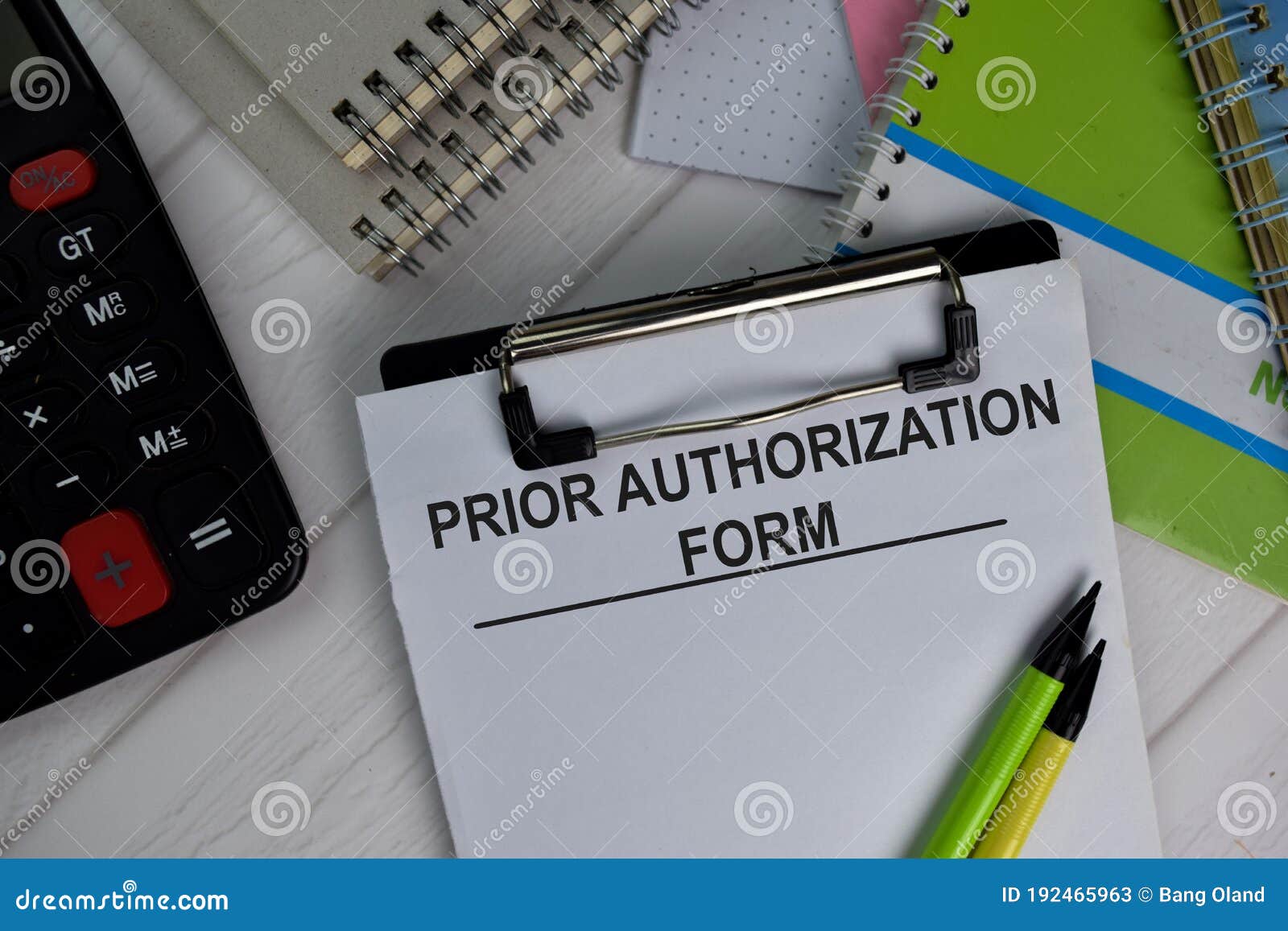 prior authorization form write on paperwork  on office desk