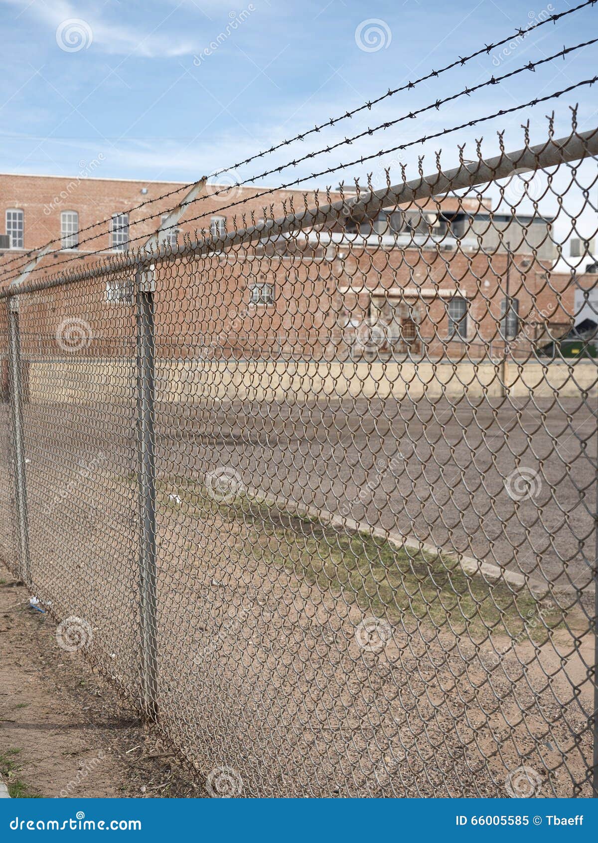 prison barb wire wall and prison building