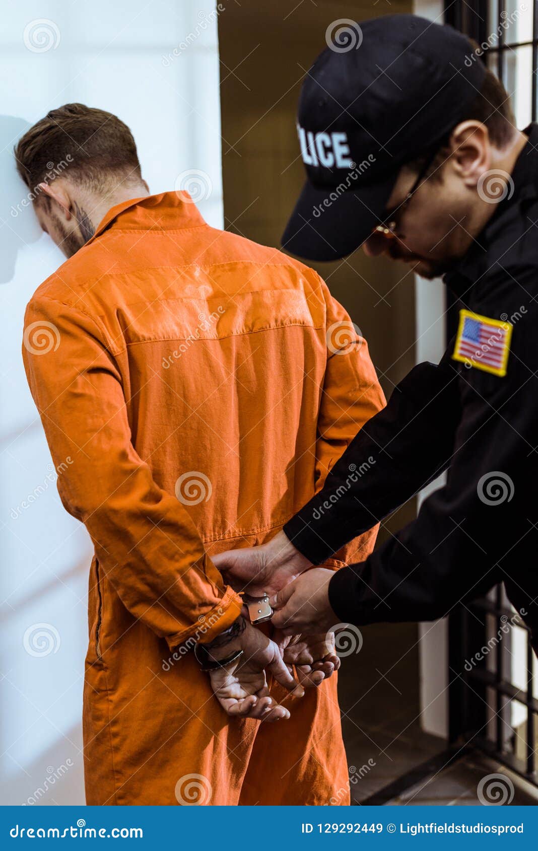 Prison Guard Wearing Handcuffs Stock Images by Megapixl