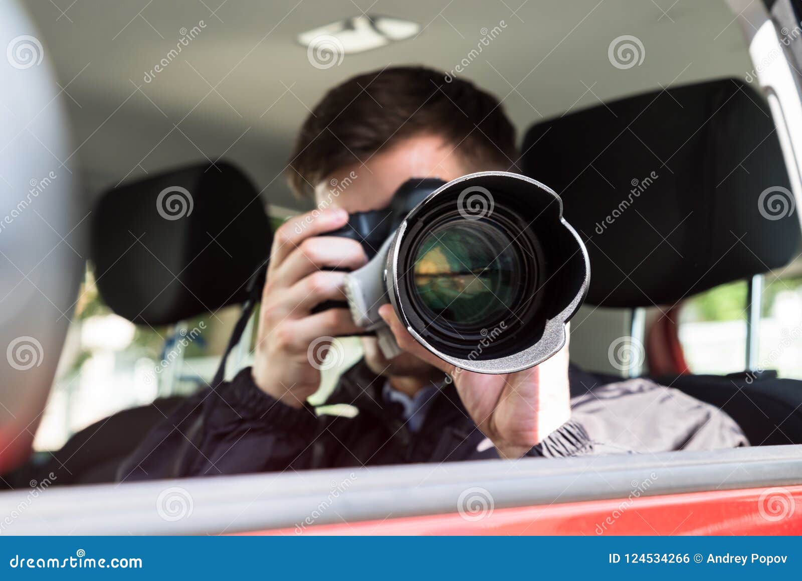 private detective photographing with slr camera