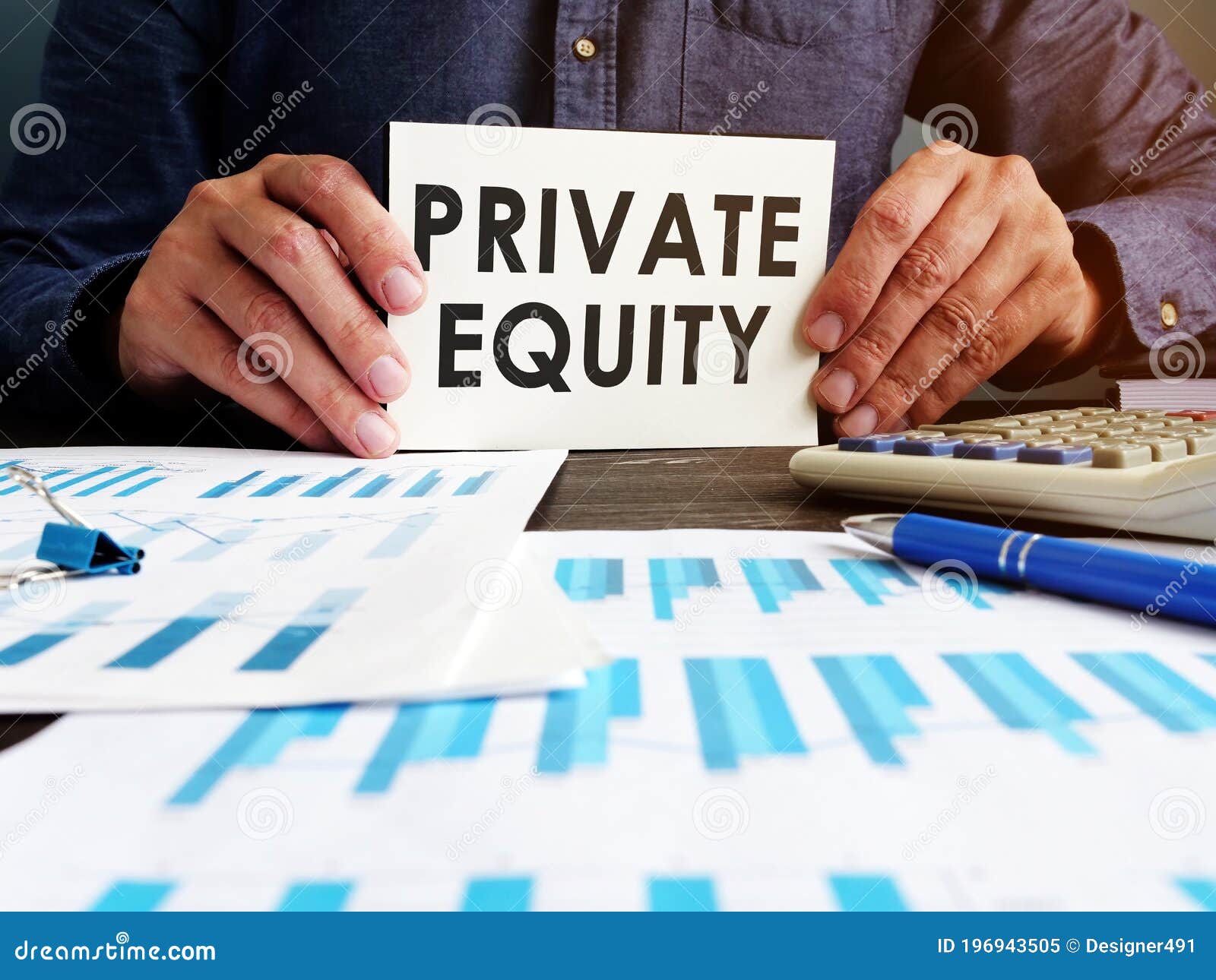 private equity concept. manager sitting at the table holds an inscription.