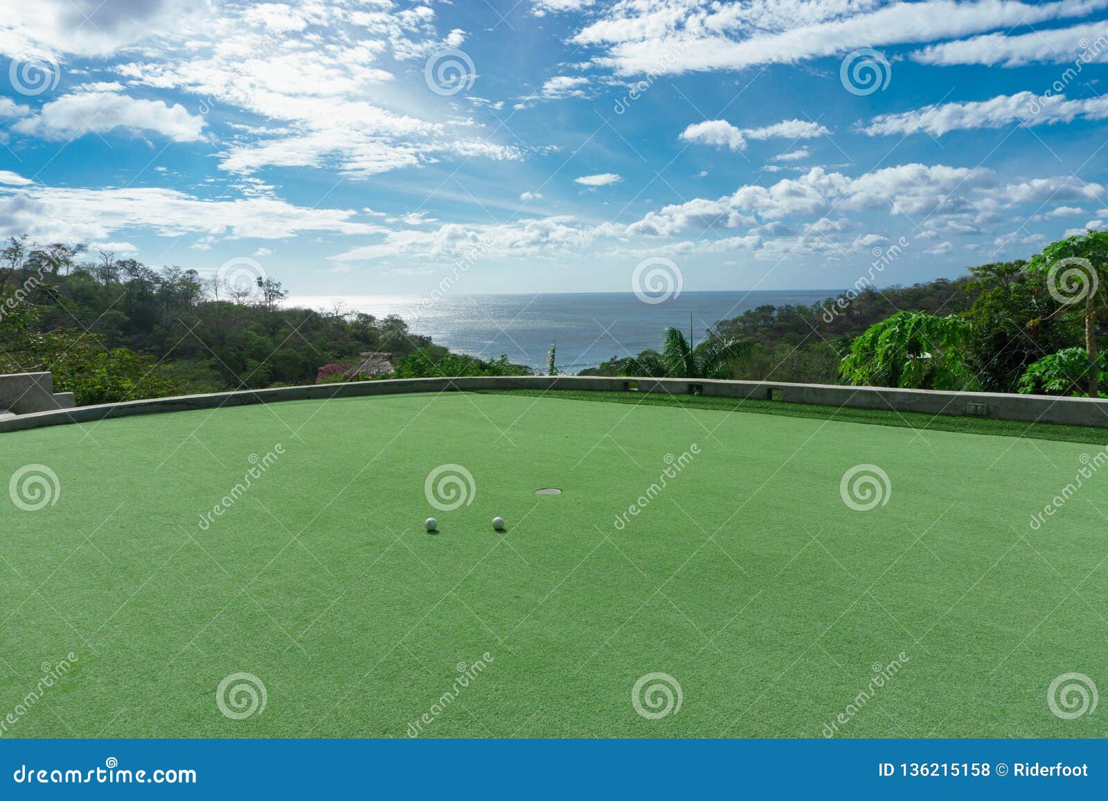 Private Golf Course with Ocean View and Beautiful Sky Stock Photo