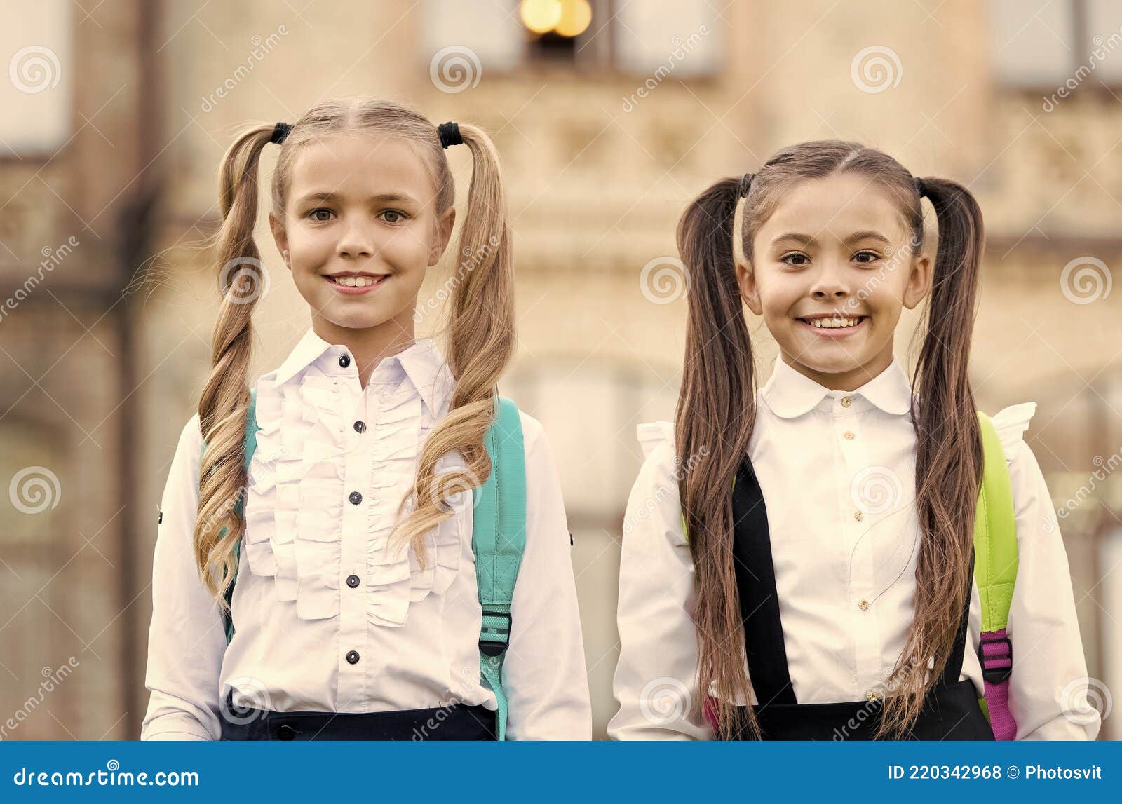 Private School for Girls. School Girls in Pigtails. Happy Girls Back To