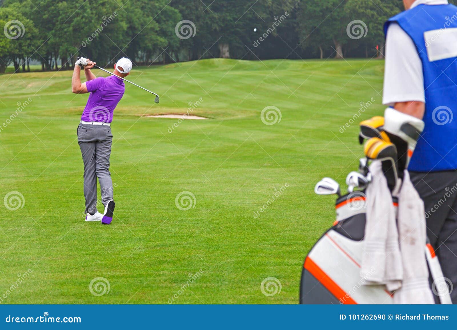 Pro Golfer Playing a Shot with Caddy Stock Photo Image of shot, club 101262690