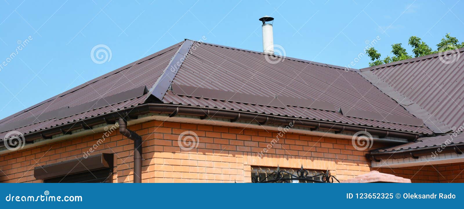 problem areas for metal roof and rain gutter waterproofing. guttering, gutters, metal roofing house panorama